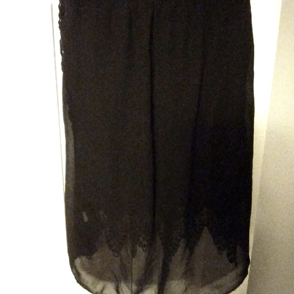 Pretty black dressy shirt. Goes with anything.